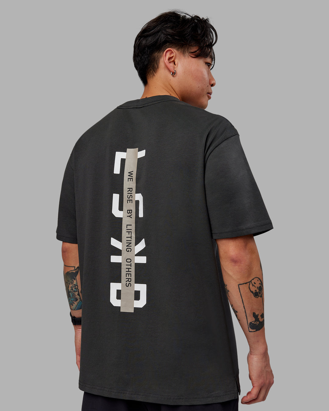 Man wearing Unisex Strike Through FLXCotton Tee Oversize - Pirate Black-Black - view 2