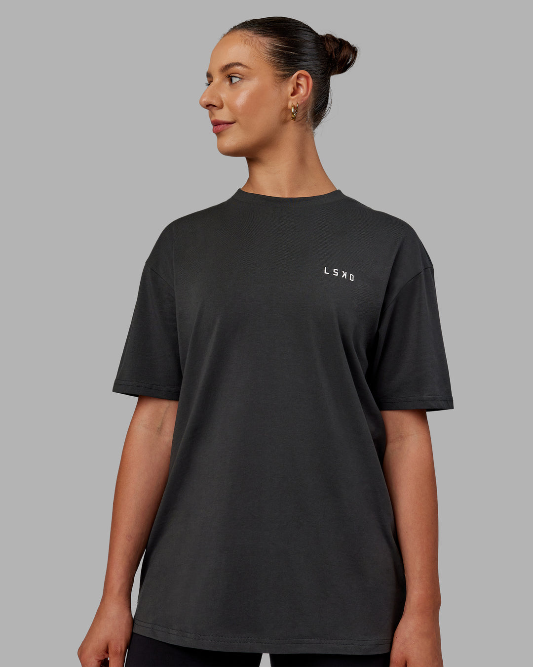 Woman wearing Unisex Strike Through FLXCotton Tee Oversize - Pirate Black-Black - view 3
