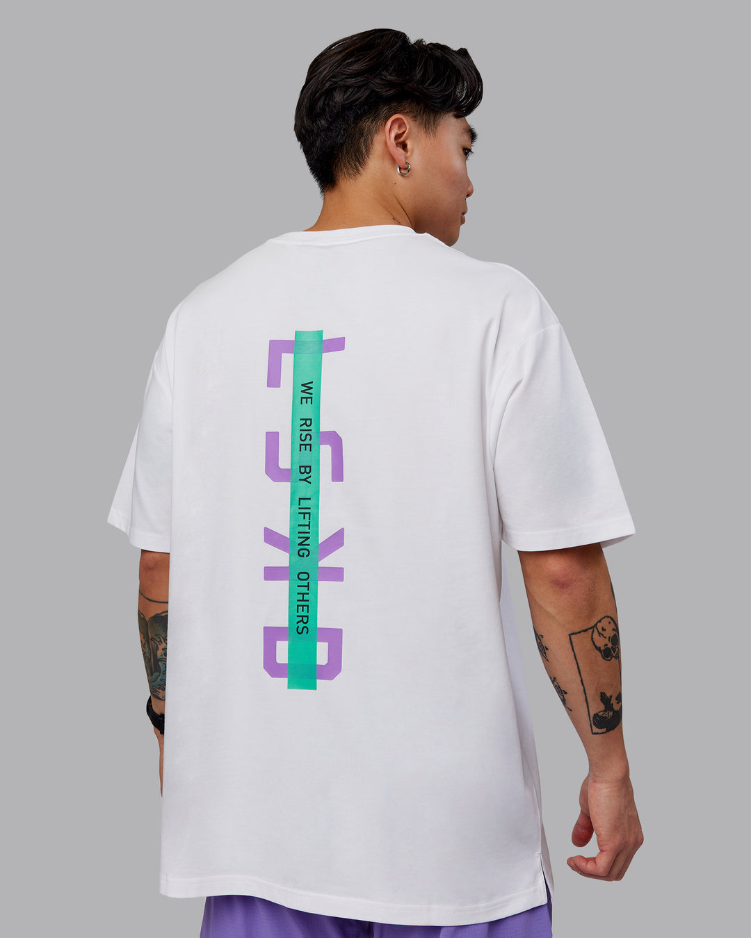 Man wearing Unisex Strike Through FLXCotton Tee Oversize - White-Purple Swirl - view 2