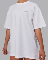 Woman wearing Unisex Strike Through FLXCotton Tee Oversize - White-Purple Swirl | Thumbnail Index: 8