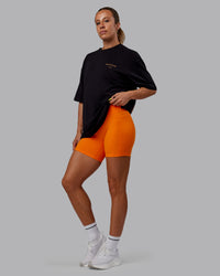 Woman wearing Unisex Trust The Process 2.0 FLXCotton Tee Oversize - Black-Vibrant Orange | Thumbnail Index: 5