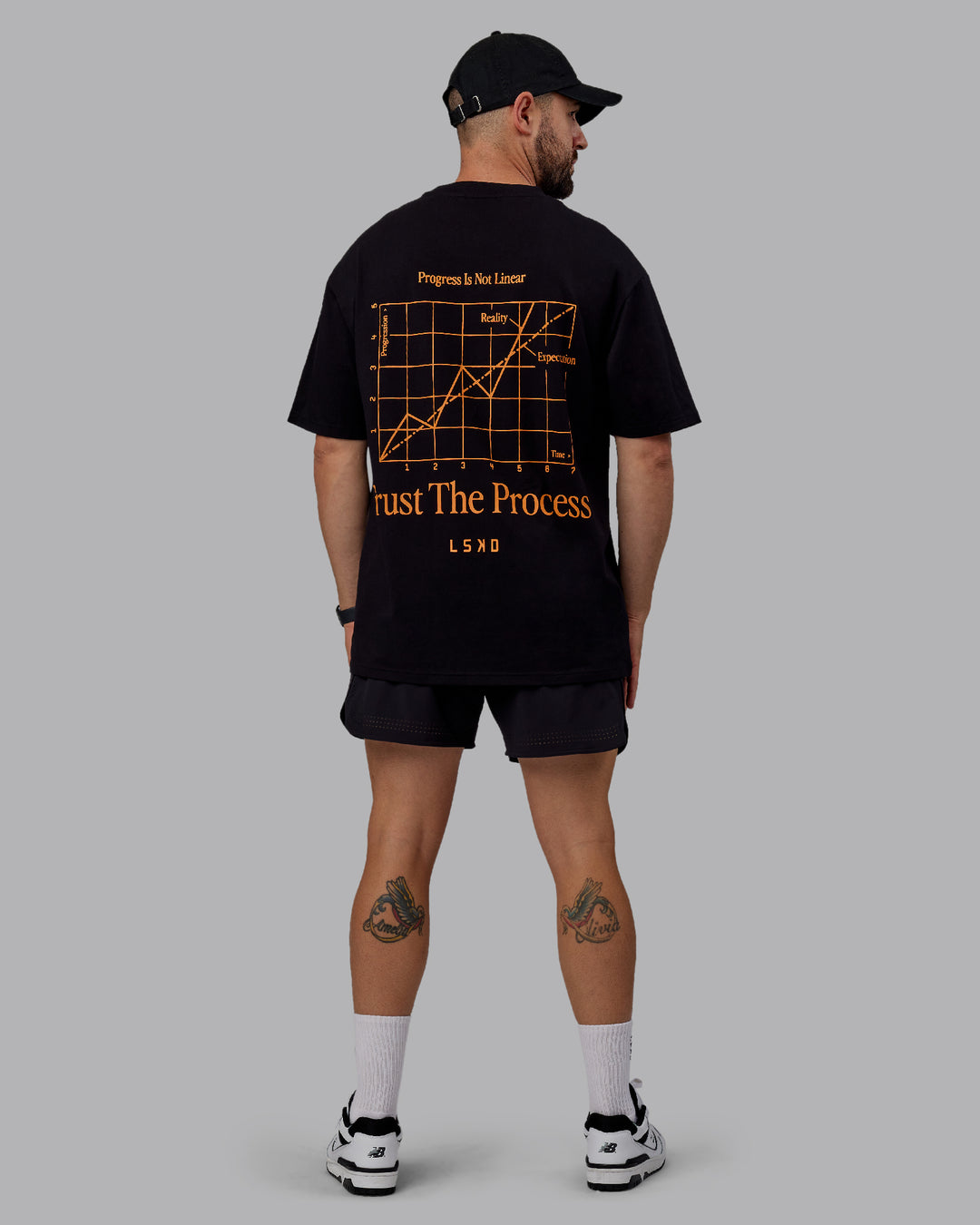 Man wearing Unisex Trust The Process 2.0 FLXCotton Tee Oversize - Black-Vibrant Orange - view 12