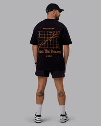 Man wearing Unisex Trust The Process 2.0 FLXCotton Tee Oversize - Black-Vibrant Orange | Thumbnail Index: 11