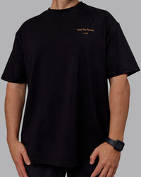 Man wearing Unisex Trust The Process 2.0 FLXCotton Tee Oversize - Black-Vibrant Orange | Thumbnail Index: 6