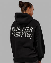 Woman wearing Unisex VS6 Hoodie Oversize - Black-White | Thumbnail Index: 1