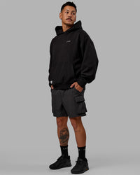 Man wearing Unisex VS6 Hoodie Oversize - Black-White | Thumbnail Index: 9
