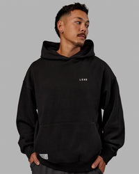 Man wearing Unisex VS6 Hoodie Oversize - Black-White | Thumbnail Index: 2