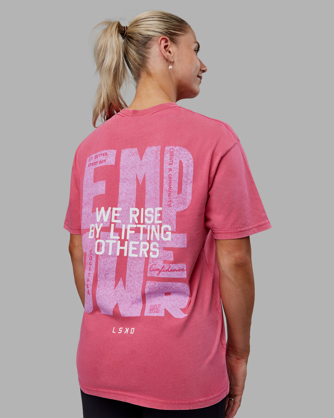 Woman wearing Unisex Washed Empower Tee Oversize - Berry Pink-Pastel Orchid - view 5