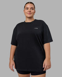 Woman wearing Unisex Washed Empower Tee Oversize - Black-Berry Pink | Thumbnail Index: 3