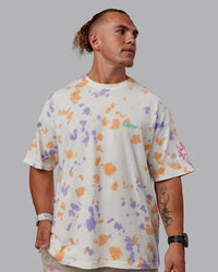 Man wearing Unisex Washed Huntington 24 Heavyweight Tee Oversize - Tie Dye Tangerine-Dahlia Purple | Thumbnail Index: 3