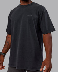 Man wearing Unisex Washed RUN CLUB FLXCotton Tee Oversize - Black-Black | Thumbnail Index: 9
