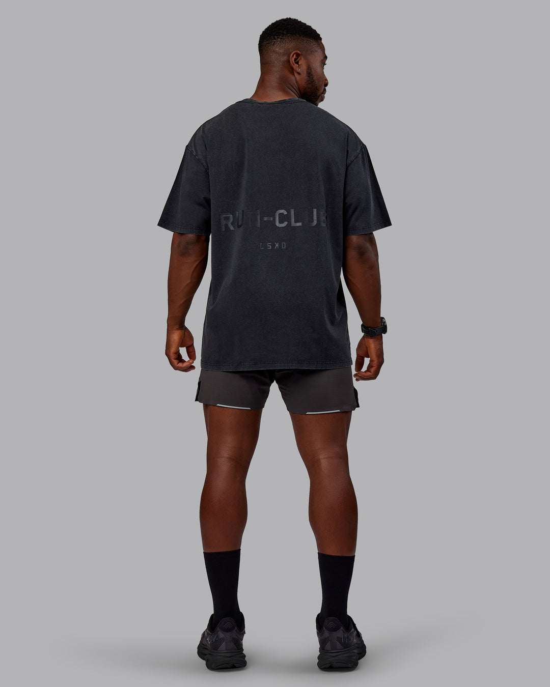 Man wearing Unisex Washed RUN CLUB FLXCotton Tee Oversize - Black-Black - view 12