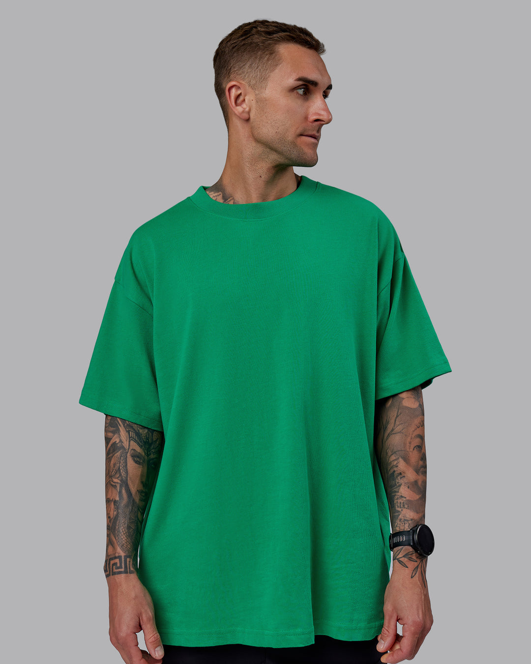 Man wearing Unisex We Rise Heavyweight Tee Oversize - Impact Green-White - view 5