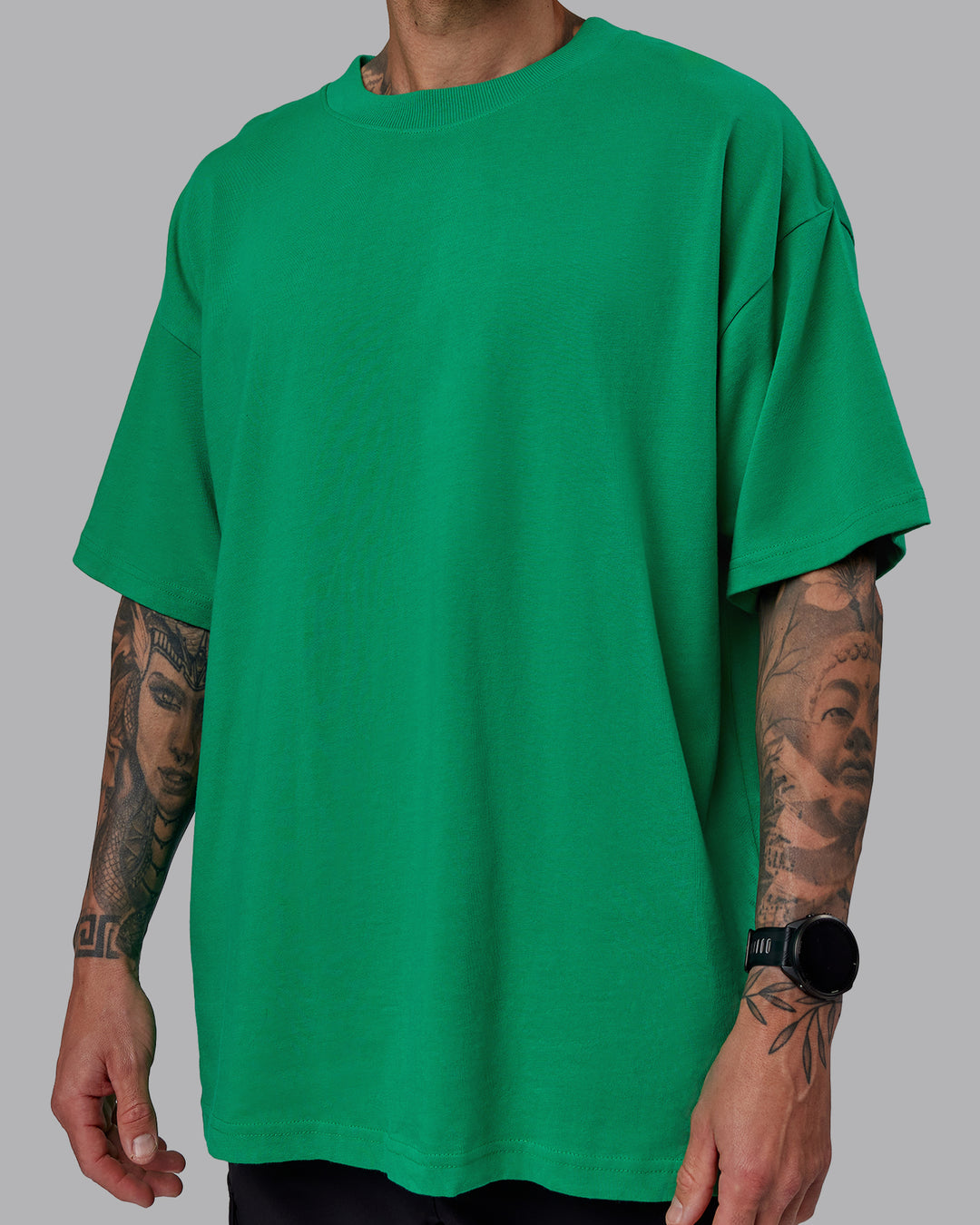 Man wearing Unisex We Rise Heavyweight Tee Oversize - Impact Green-White - view 9