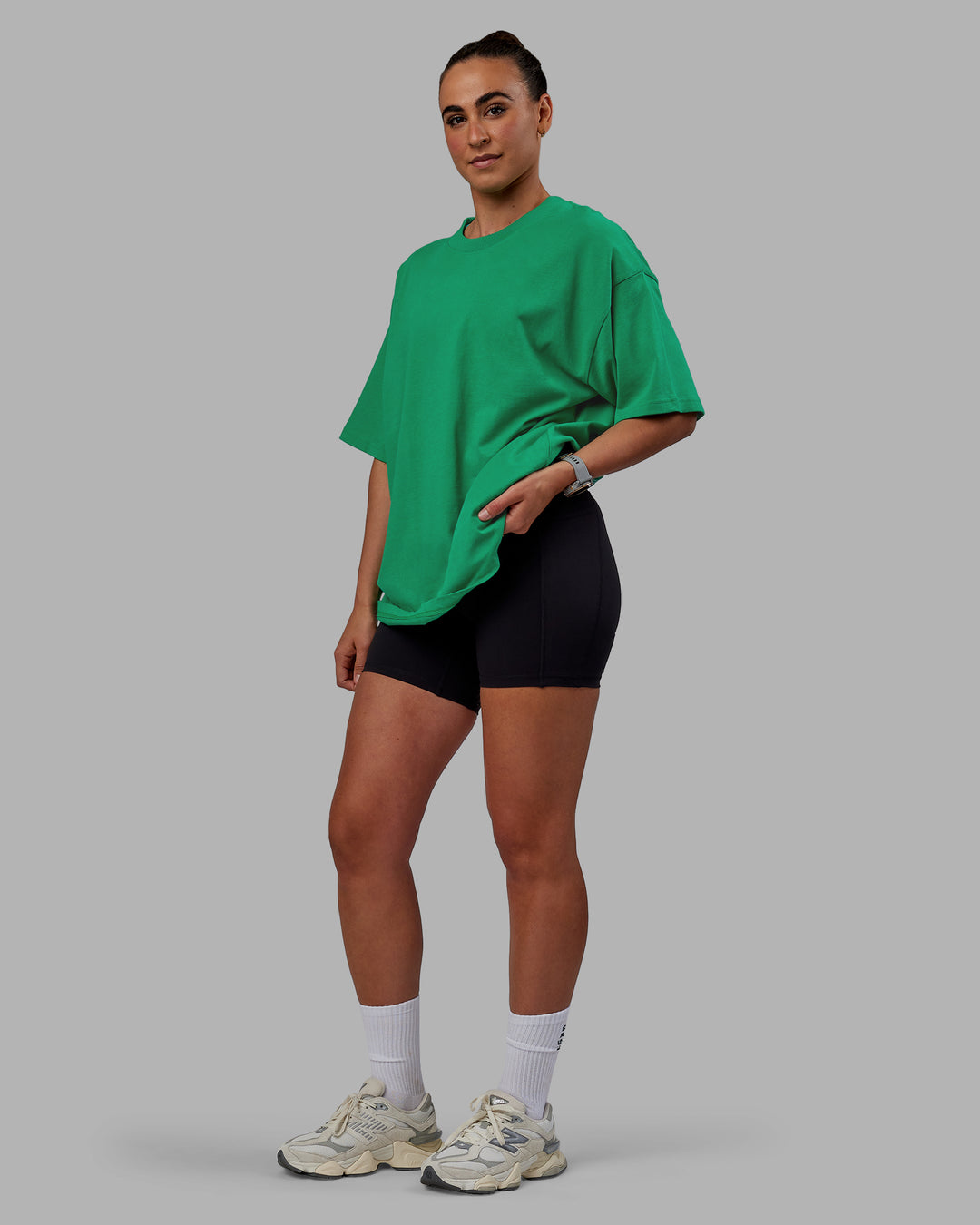 Woman wearing Unisex We Rise Heavyweight Tee Oversize - Impact Green-White - view 3