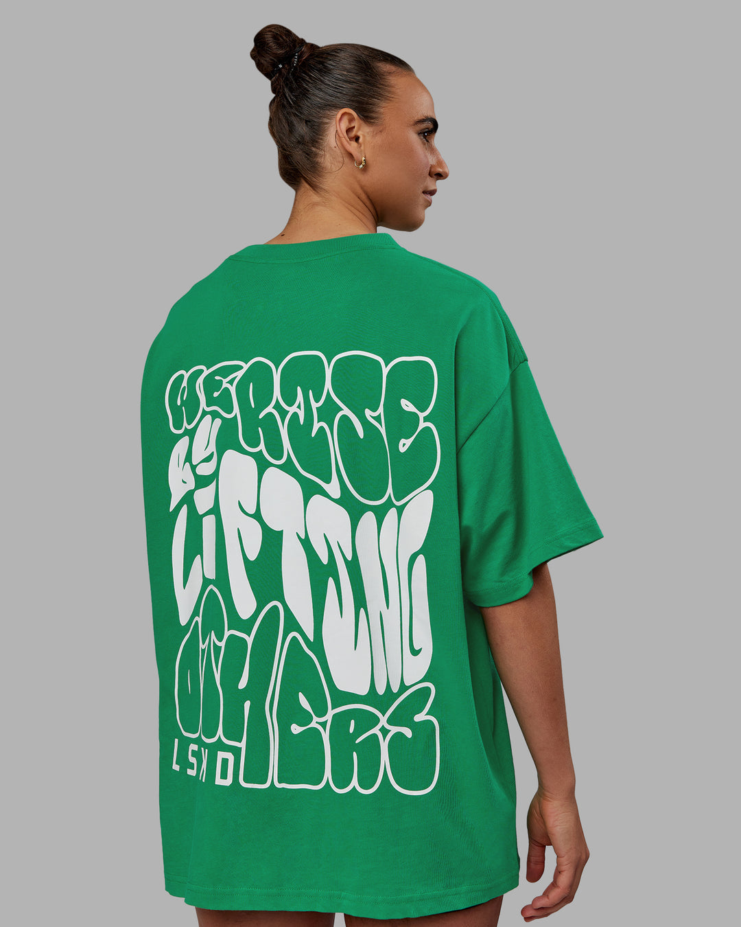 Woman wearing Unisex We Rise Heavyweight Tee Oversize - Impact Green-White - view 12