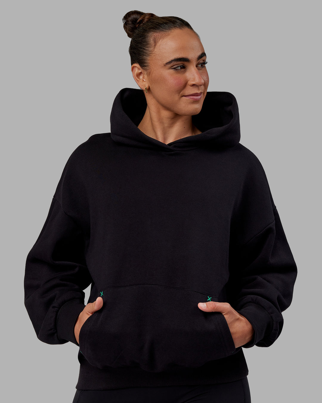 Woman wearing Unisex We Rise Hoodie Oversize - Black-Impact Green - view 5