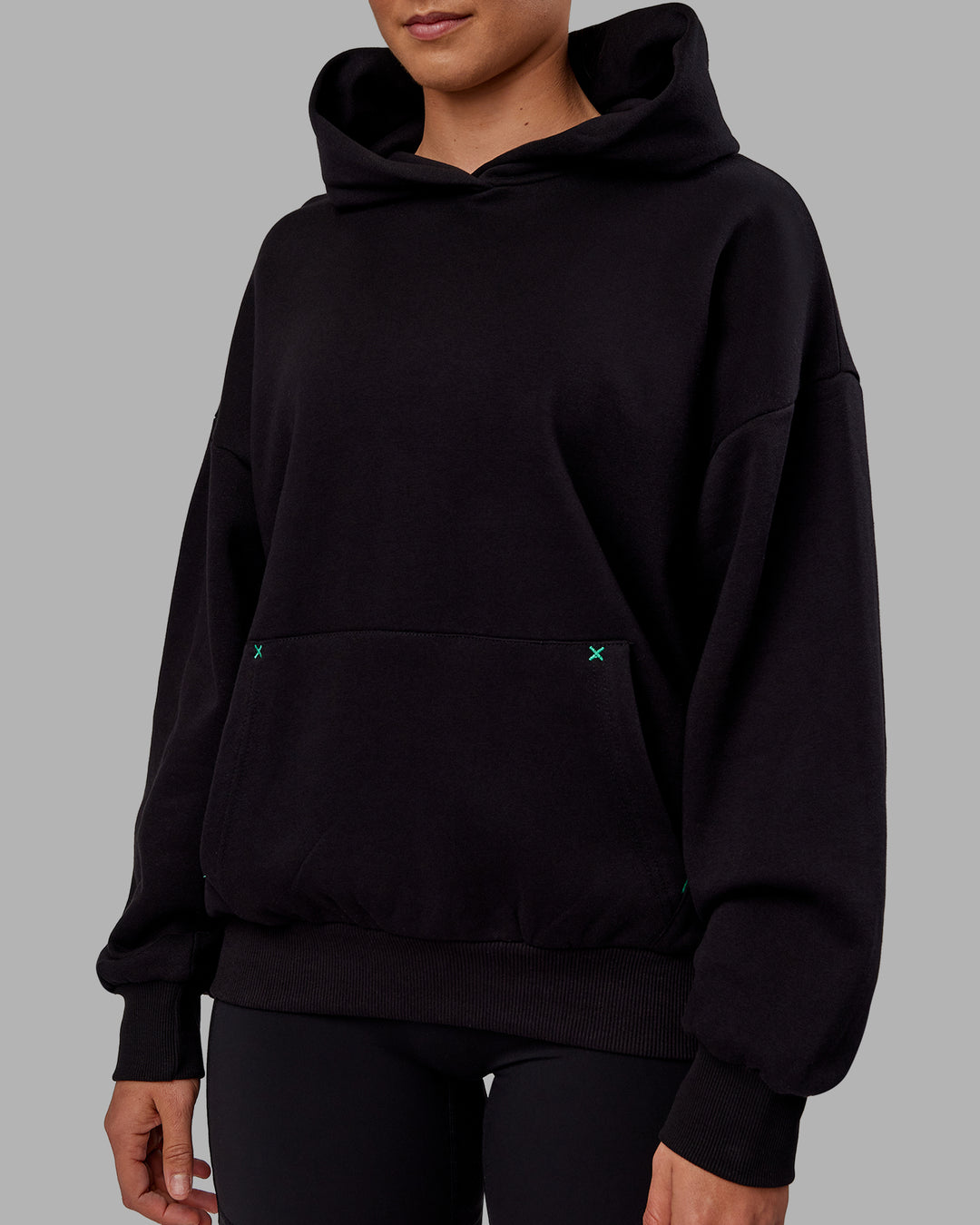 Woman wearing Unisex We Rise Hoodie Oversize - Black-Impact Green - view 11