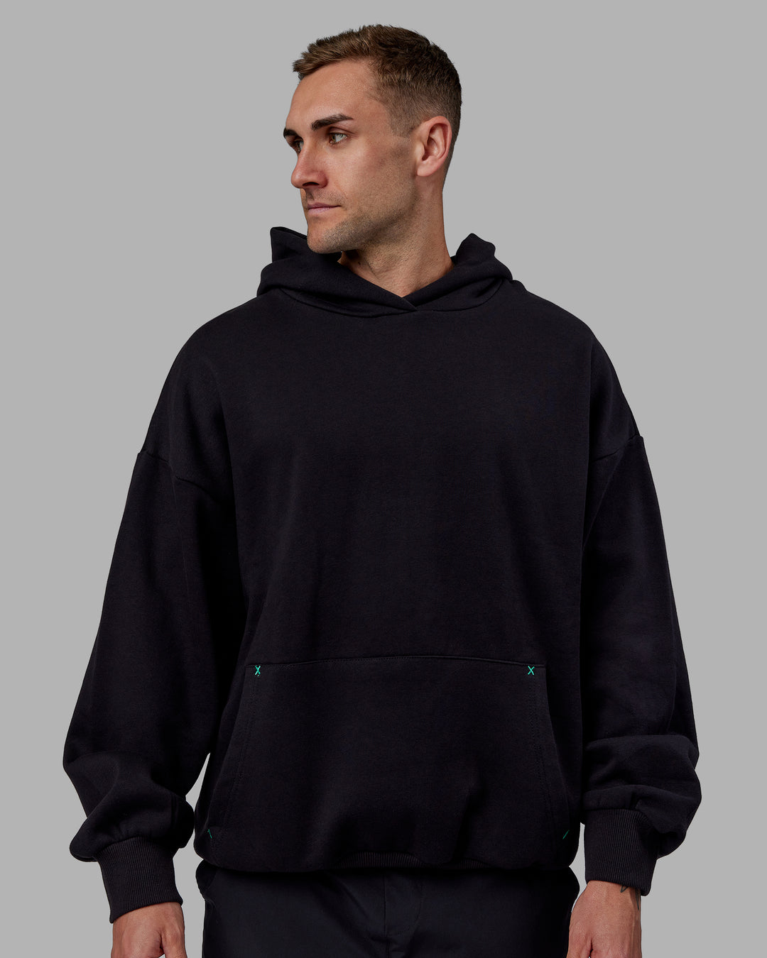 Man wearing Unisex We Rise Hoodie Oversize - Black-Impact Green - view 3