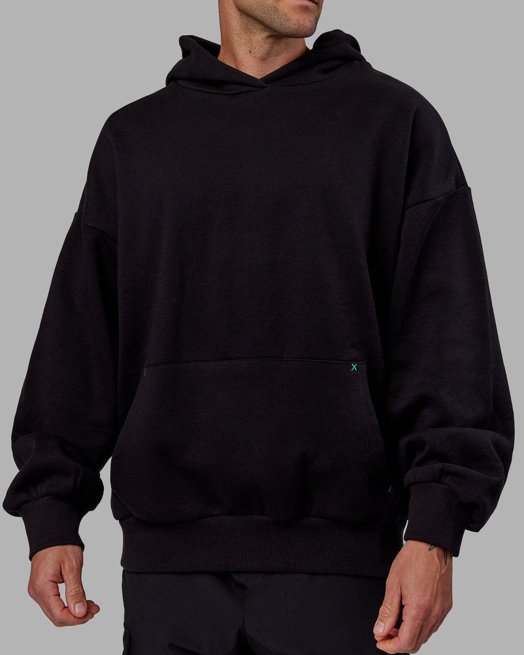 Man wearing Unisex We Rise Hoodie Oversize - Black-Impact Green - view 12