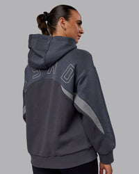 Woman wearing Unisex Y2K Concept Panel Hoodie - Asphalt-Turbulance | Thumbnail Index: 5