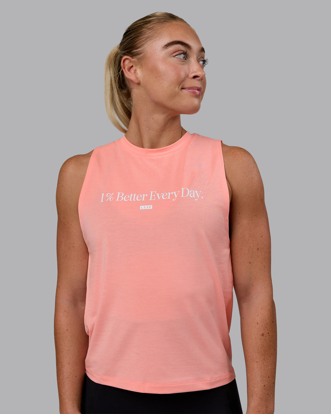 Woman wearing Unleash 1% Better Training Tank - Murex Shell-White - view 1