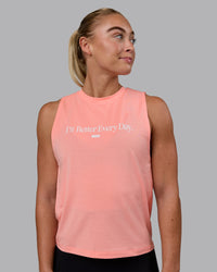 Woman wearing Unleash 1% Better Training Tank - Murex Shell-White | Thumbnail Index: 0