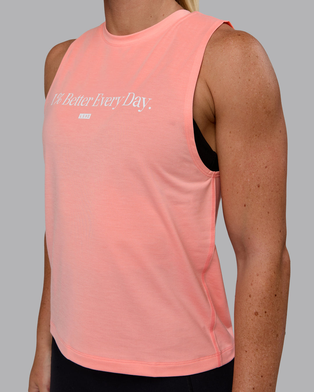 Woman wearing Unleash 1% Better Training Tank - Murex Shell-White - view 3