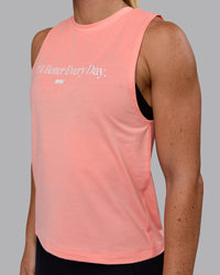 Woman wearing Unleash 1% Better Training Tank - Murex Shell-White | Thumbnail Index: 2