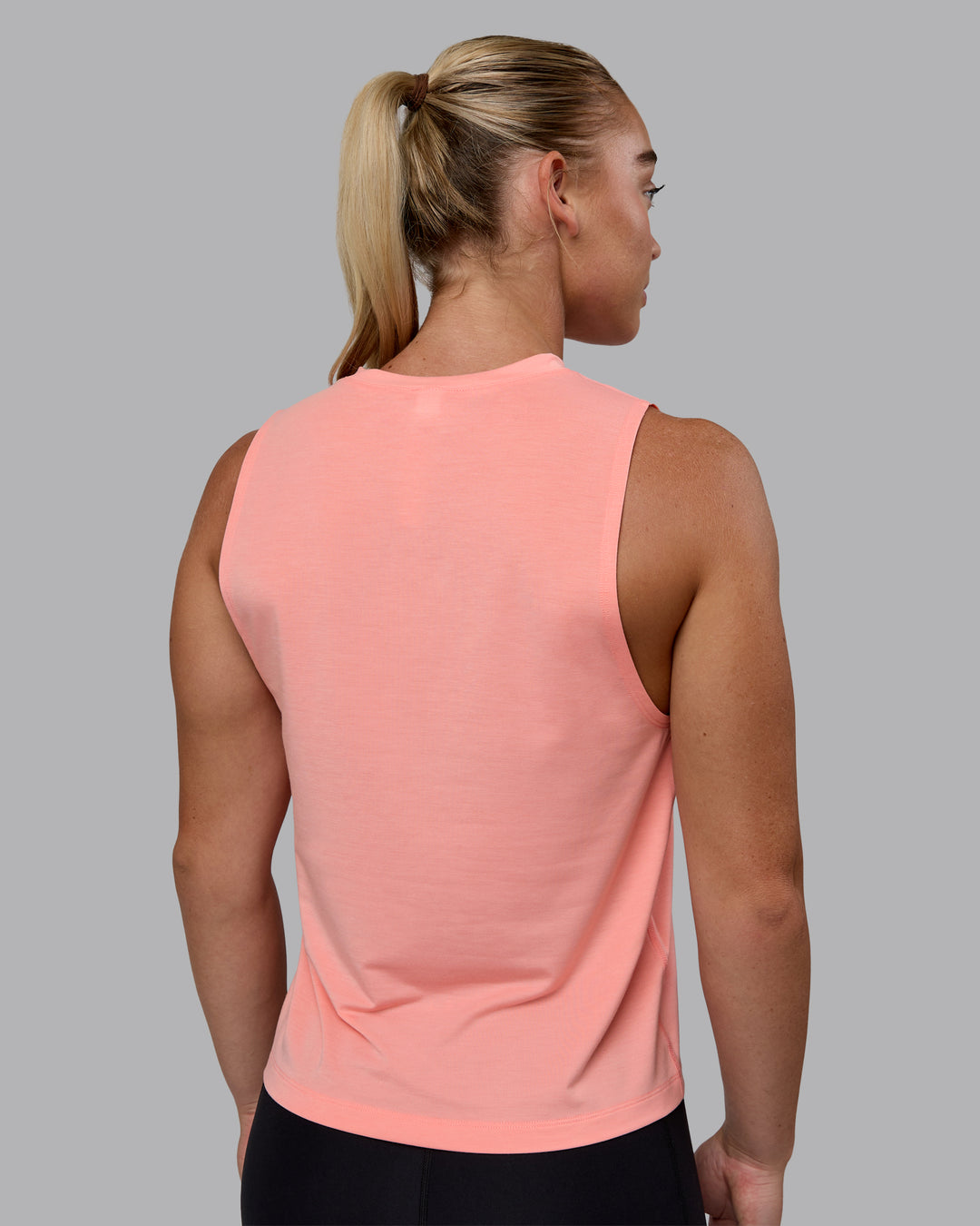 Woman wearing Unleash 1% Better Training Tank - Murex Shell-White - view 4