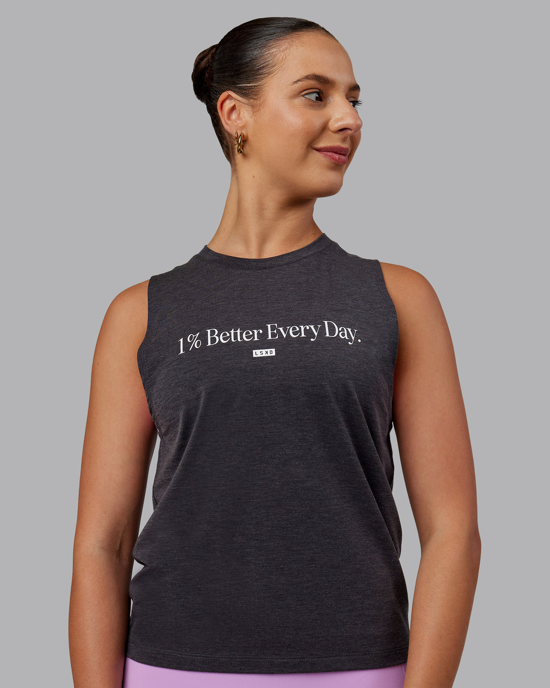 Woman wearing Unleash 1% Better Training Tank - Charcoal Marl-White - view 1