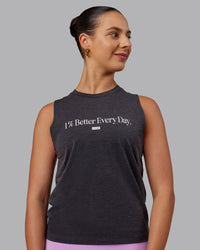 Woman wearing Unleash 1% Better Training Tank - Charcoal Marl-White | Thumbnail Index: 0