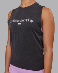 Woman wearing Unleash 1% Better Training Tank - Charcoal Marl-White | Thumbnail Index: 2