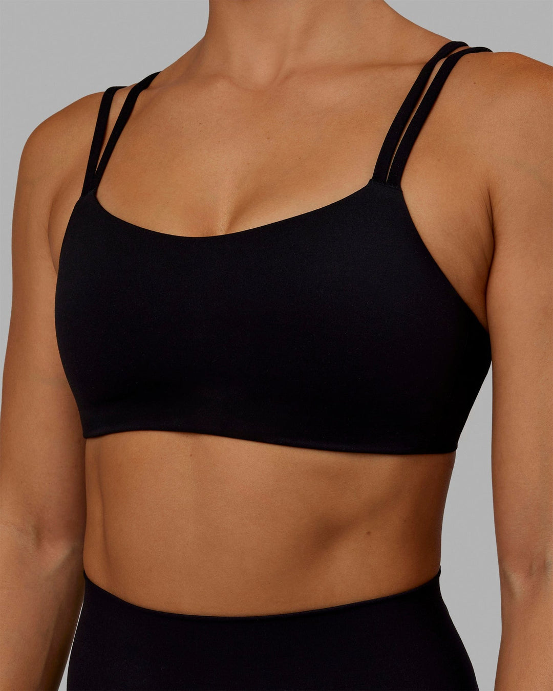 Woman wearing Vantage Sports Bra - Black - view 5