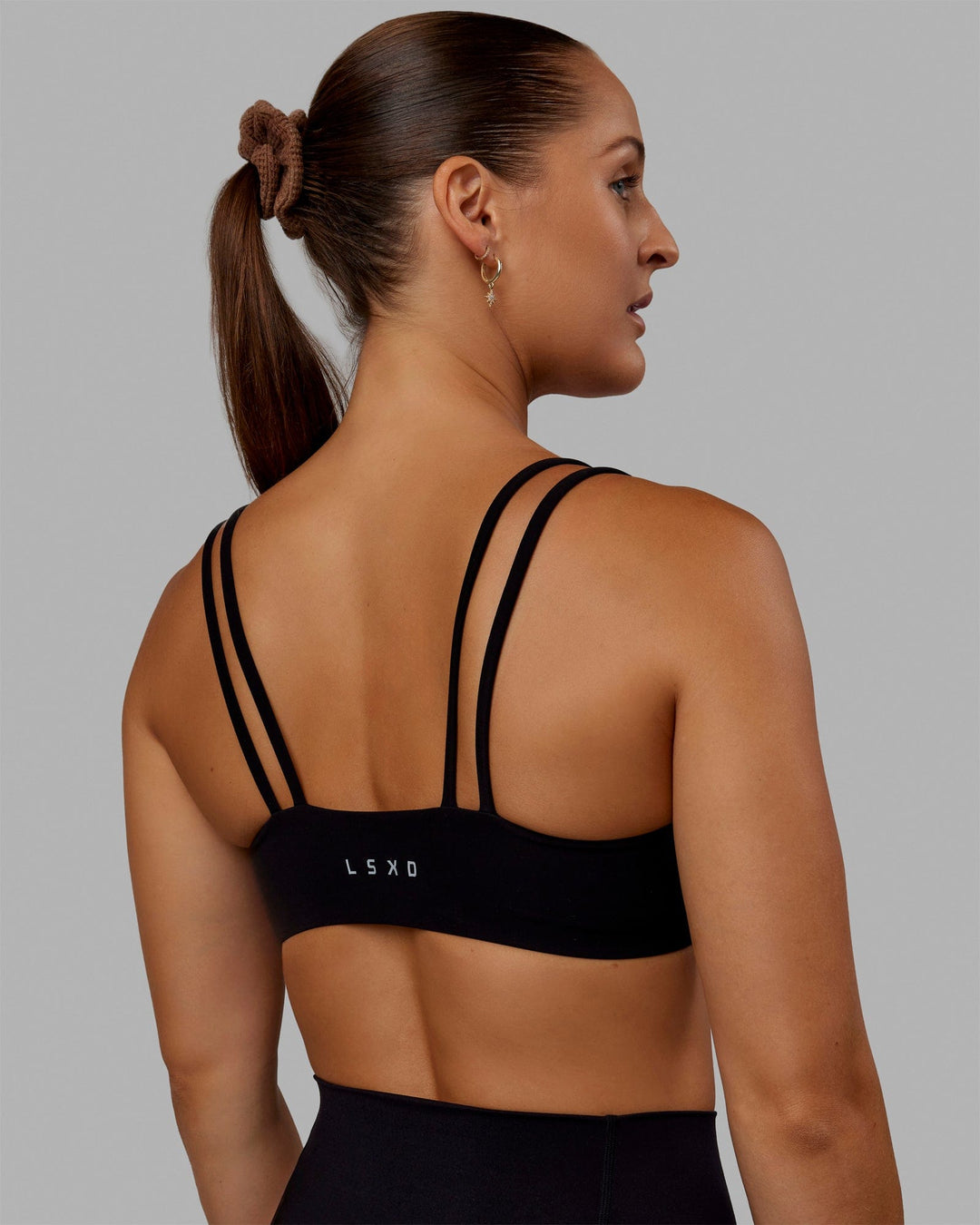 Woman wearing Vantage Sports Bra - Black - view 2