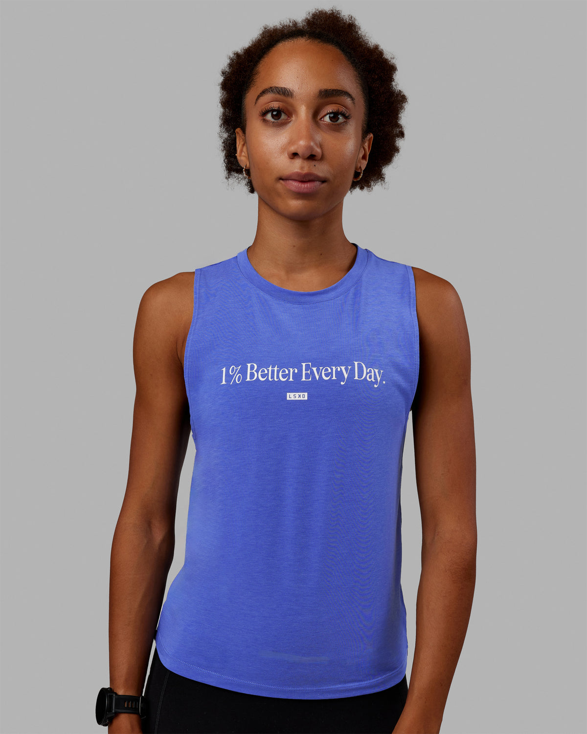 Woman wearing Vital 1% Better Training Tank - Power Cobalt-White