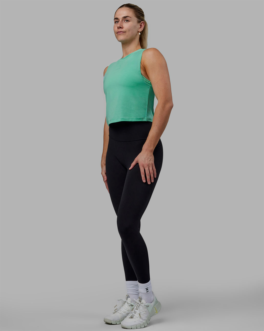 Woman wearing Vital Cropped Training Tank - Cockatoo - view 3