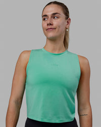 Woman wearing Vital Cropped Training Tank - Cockatoo | Thumbnail Index: 1