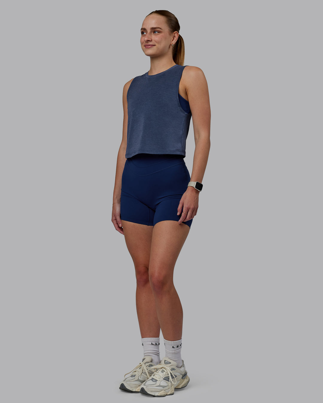 Woman wearing Vital Cropped Training Tank - Midnight Blue - view 1