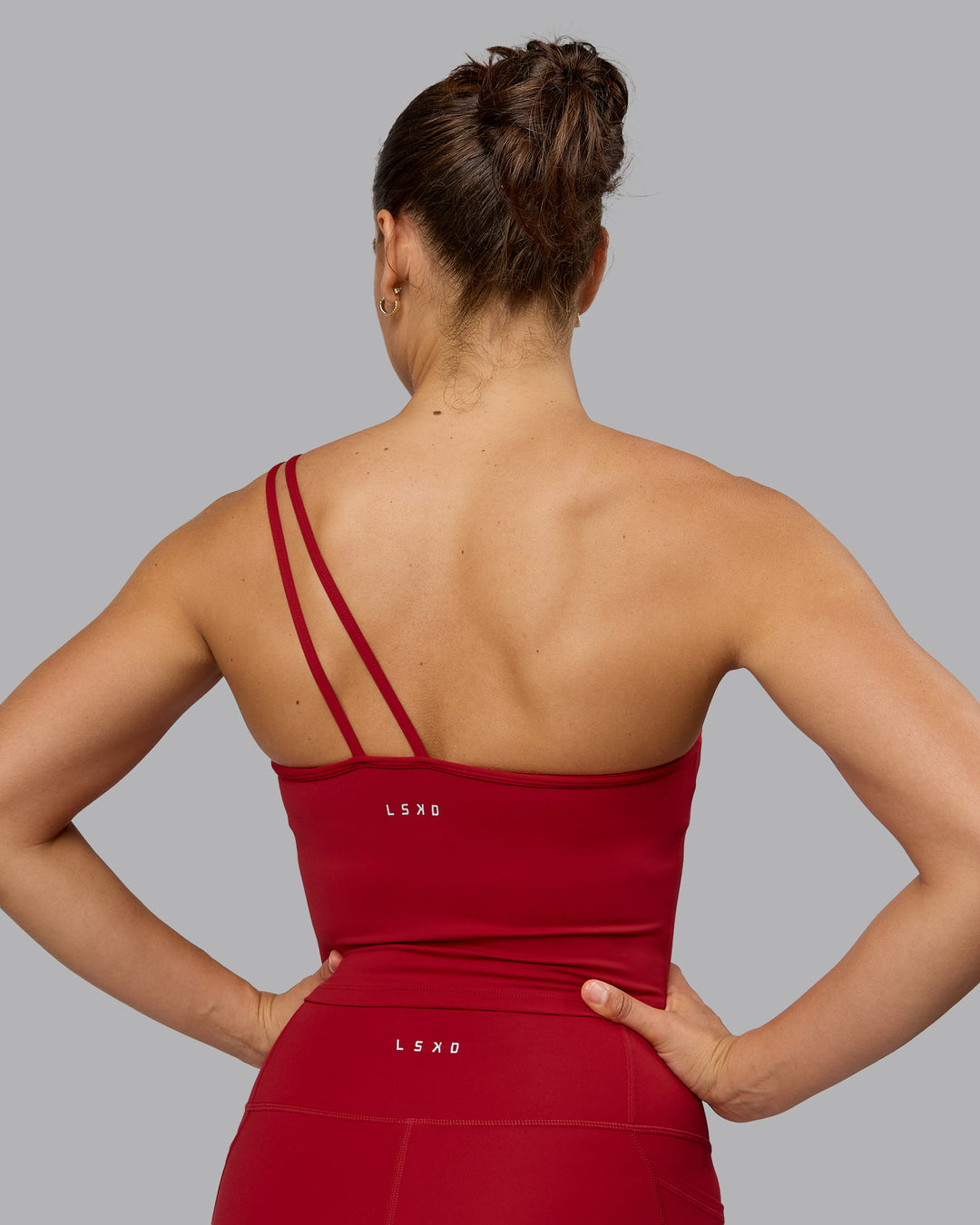 Woman wearing Vivid Skimmer Shelf Bra Tank - Cherry Red - view 3