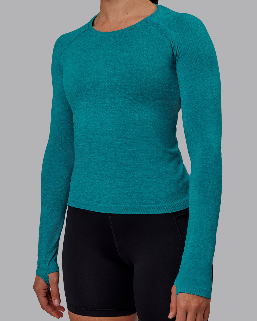 Woman wearing AeroFLX+ Seamless Long Sleeve Tee - Blue Bird Marl - view 5