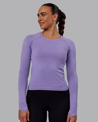 Woman wearing AeroFLX+ Seamless Long Sleeve Tee - Dahlia Purple Marl | Thumbnail Index: 0