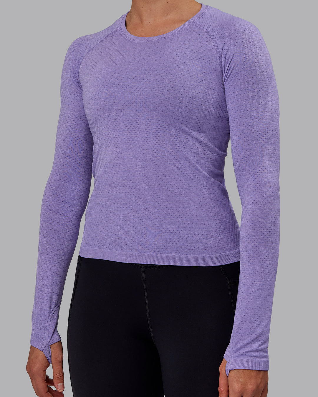 Woman wearing AeroFLX+ Seamless Long Sleeve Tee - Dahlia Purple Marl - view 4