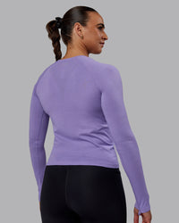 Woman wearing AeroFLX+ Seamless Long Sleeve Tee - Dahlia Purple Marl | Thumbnail Index: 2
