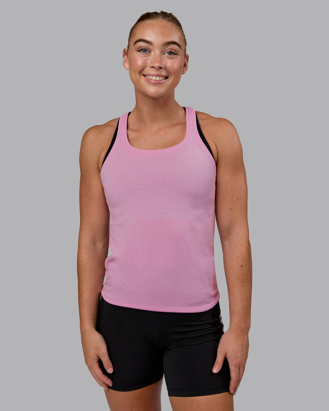 Woman wearing AeroFLX+ Seamless Tank - Pirouette/Bubblegum - view 4