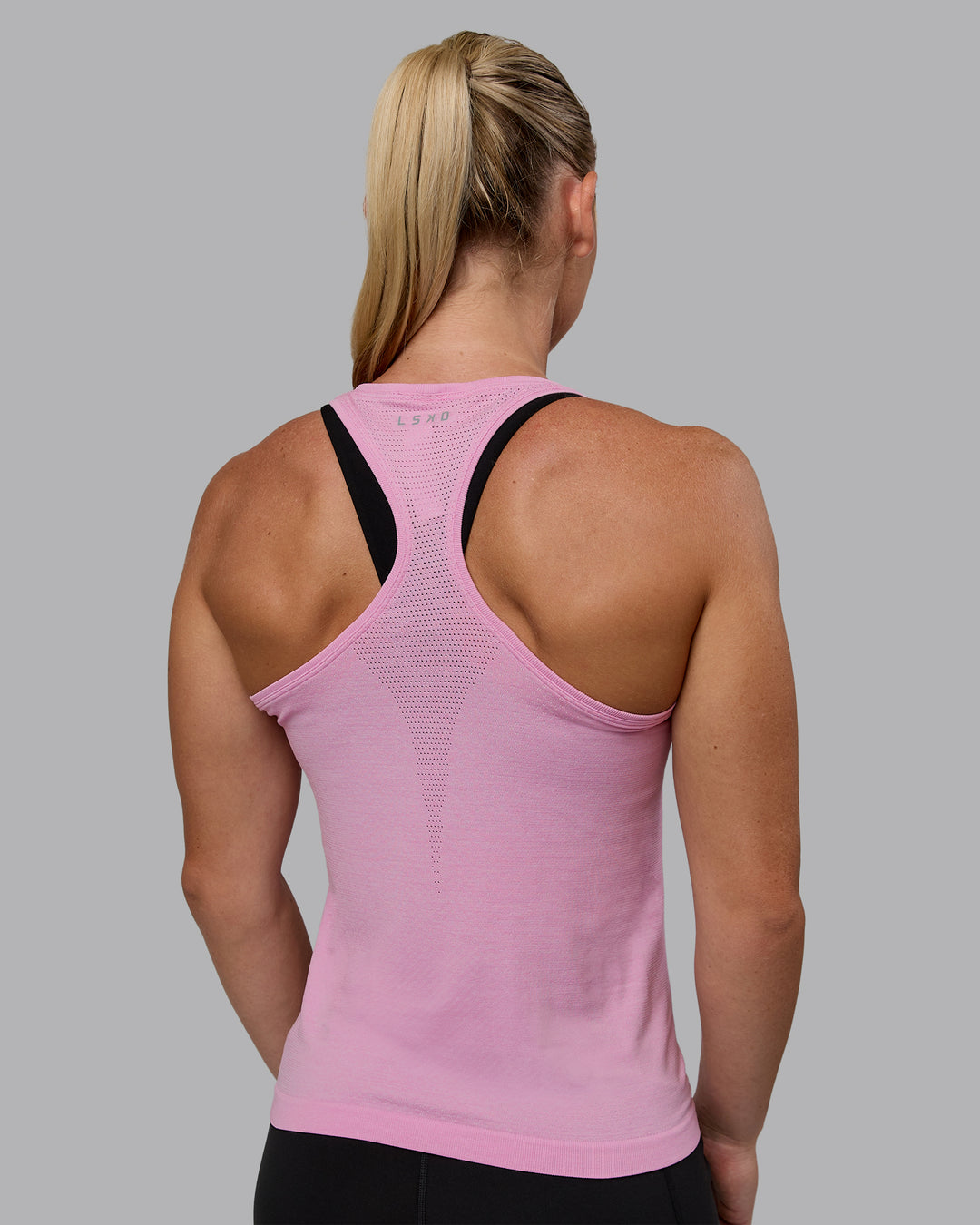 Woman wearing AeroFLX+ Seamless Tank - Pirouette/Bubblegum - view 2