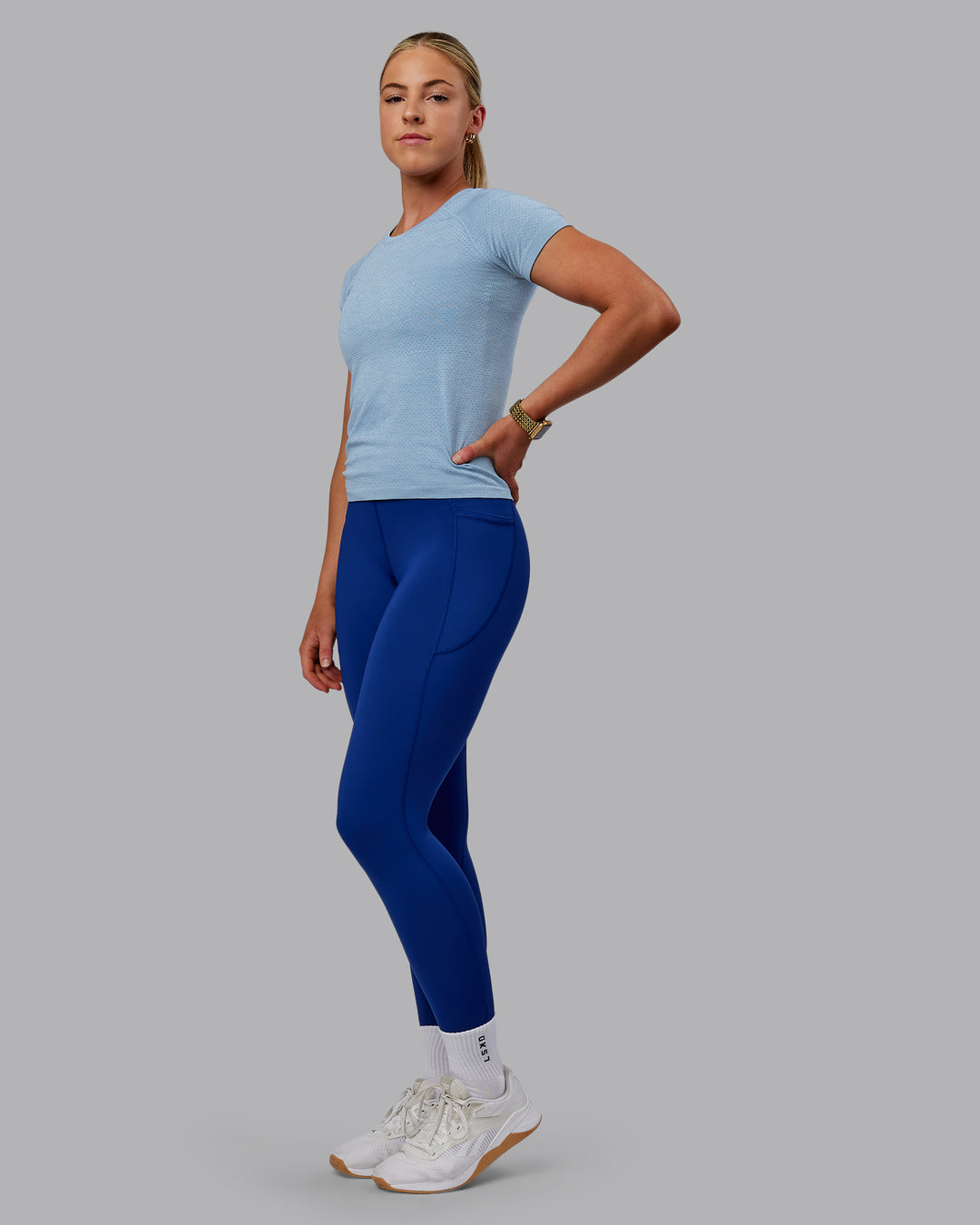 Woman wearing AeroFLX+ Seamless Tee - Elemental Blue/Ice Blue - view 2