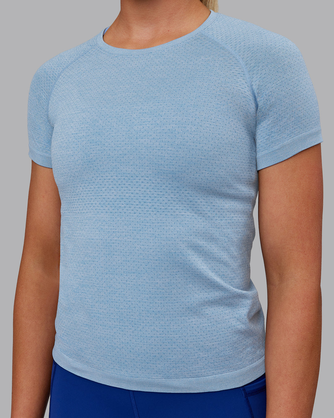 Woman wearing AeroFLX+ Seamless Tee - Elemental Blue/Ice Blue - view 7