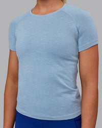 Woman wearing AeroFLX+ Seamless Tee - Elemental Blue/Ice Blue | Thumbnail Index: 6