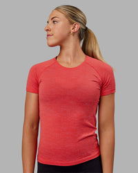 Woman wearing AeroFLX+ Seamless Tee - Fuchsia Pink/Grenadine | Thumbnail Index: 0